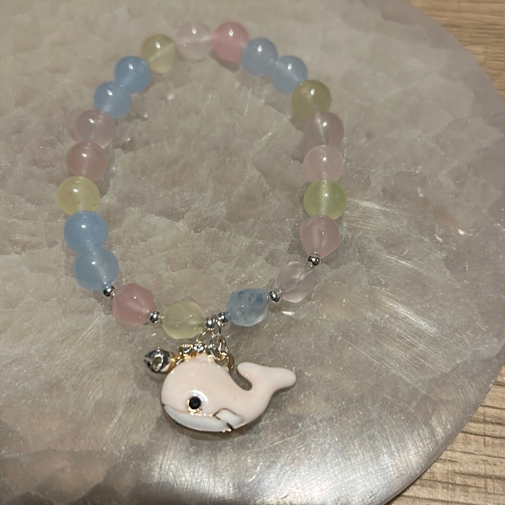Morganite faceted and round stones with whale and bell charms